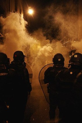 340px-Police_fighting_against_anti-Sarkozy_with_tear_gas_(487645695)
